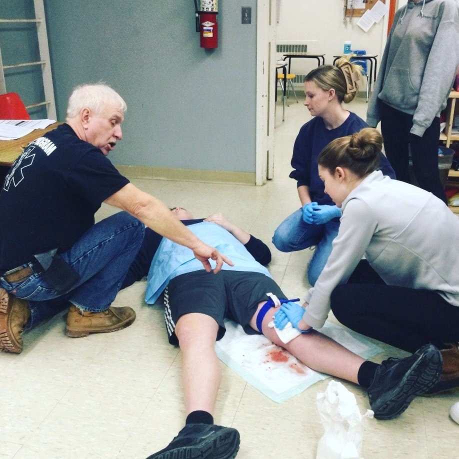 EMT students practice emergency care on each other