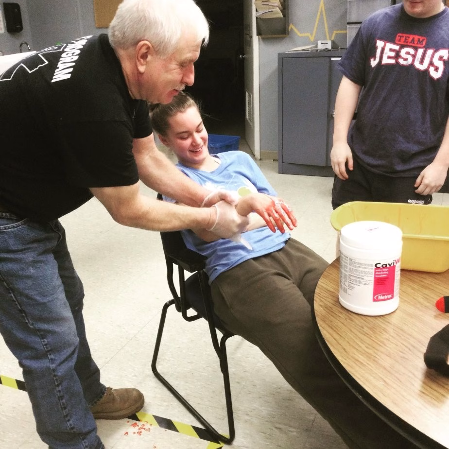 EMT students practice emergency care on each other