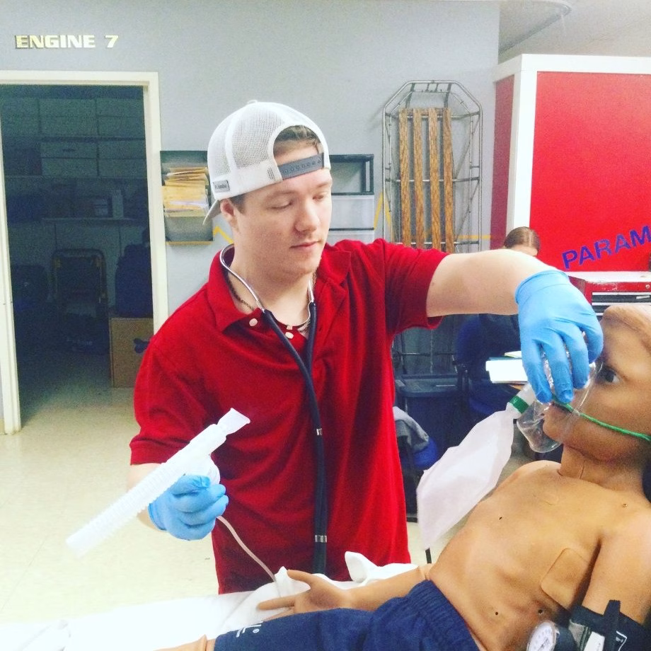 EMT student practices with breathing tube insertion