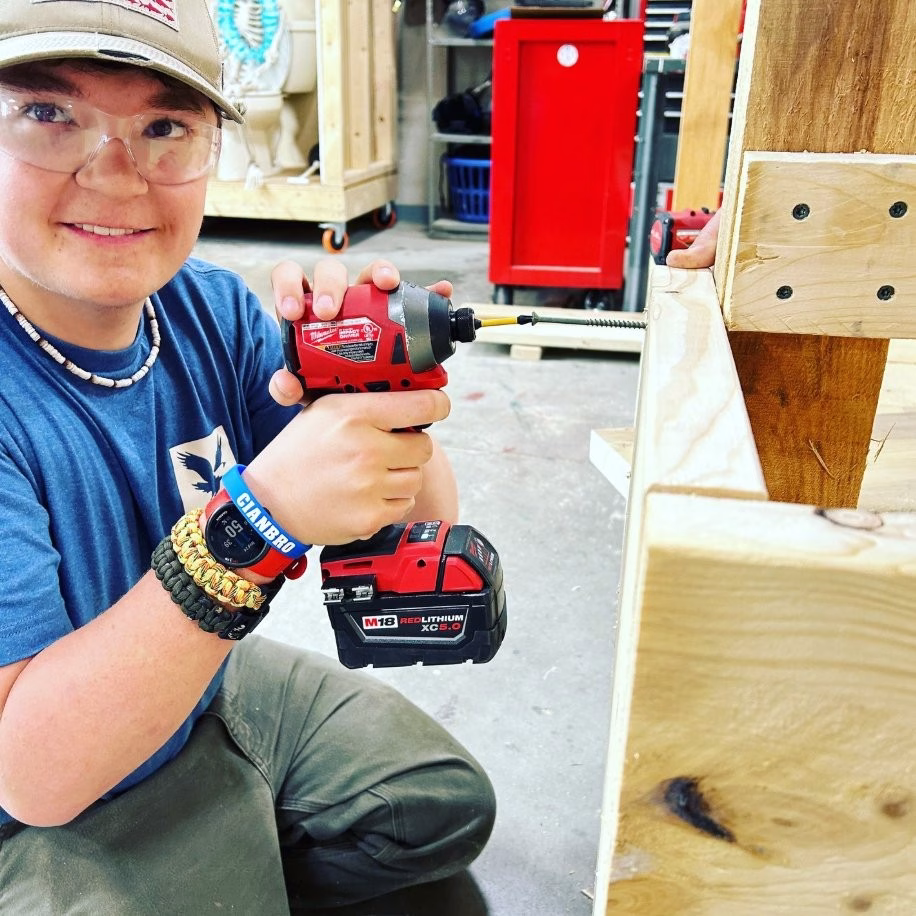General trades student working with wood